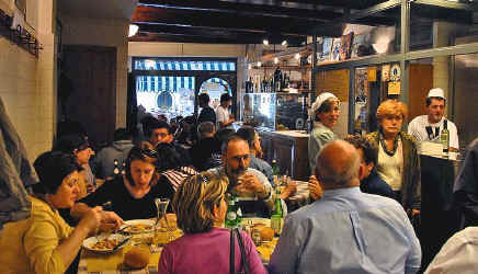 What will a restaurant meal cost in Tuscany?